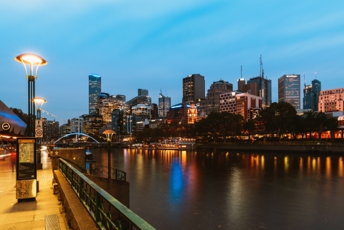 Horizontal shot of Yarra river and city buildings in the evening