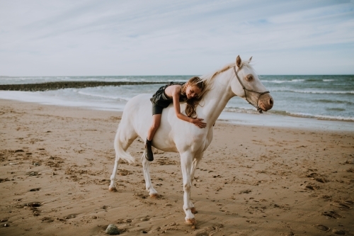 Horse riding on beach - Australian Stock Image