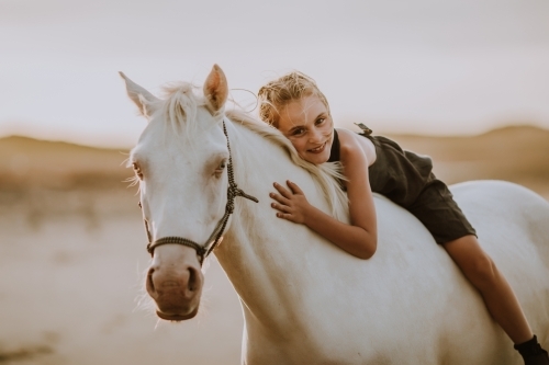 Horse riding on beach - Australian Stock Image