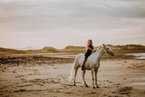 Horse riding on beach - Australian Stock Image