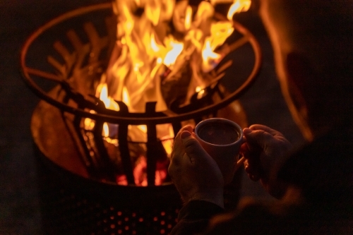 Hot chocolate and firepit - Australian Stock Image