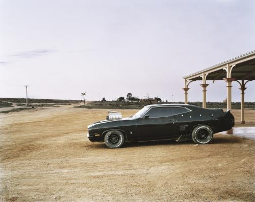 Hotted up black car in remote outback town - Australian Stock Image
