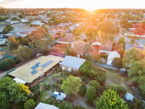 House and garden at sunset in small town - Australian Stock Image