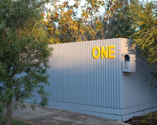 House fence with the number one one it in letters and numbers - Australian Stock Image