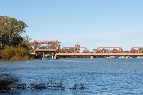 Houseboat under bridge - Australian Stock Image