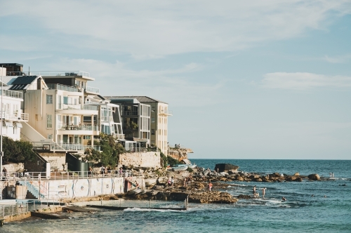houses and apartments on the edge of Bondi Beach north side of the ocean