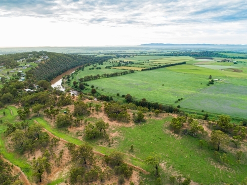 Houses with view over cliff and green Long Point farm paddocks - Australian Stock Image