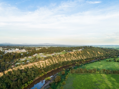 Houses with view over cliff and green Long Point farm paddocks - Australian Stock Image