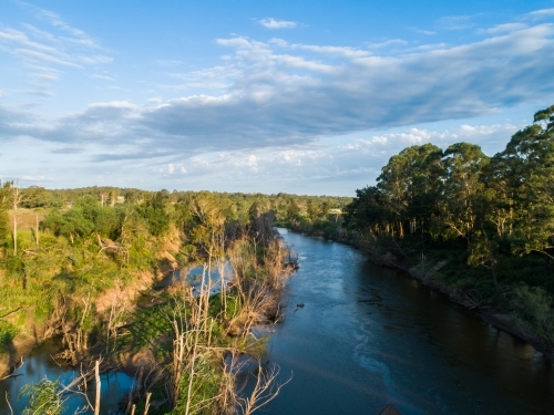 Hunter river in afternoon light reflecting blue summer sky in NSW Australia - Australian Stock Image