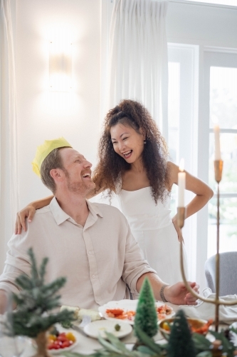 Husband and wife together at Christmas table - Australian Stock Image