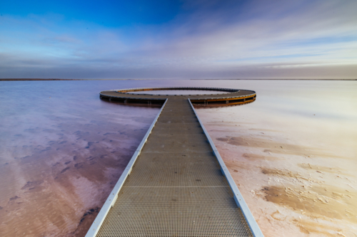 Iconic viewing platform at the famous and popular Lake Tyrrell which is a large salt lake at sunset - Australian Stock Image