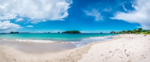 Idealistic white sand beach with blue sky and aqua water