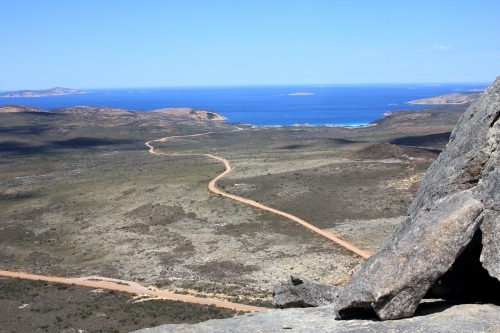 View towards ocean from top of granite peak - Australian Stock Image