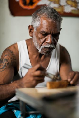 Indigenous Australian Artist at work - Australian Stock Image
