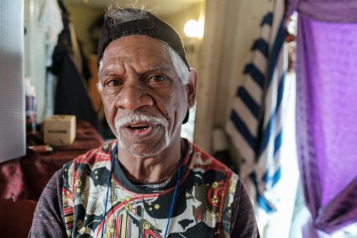 Indigenous Australian Man Indoors Looking at Camera - Australian Stock Image