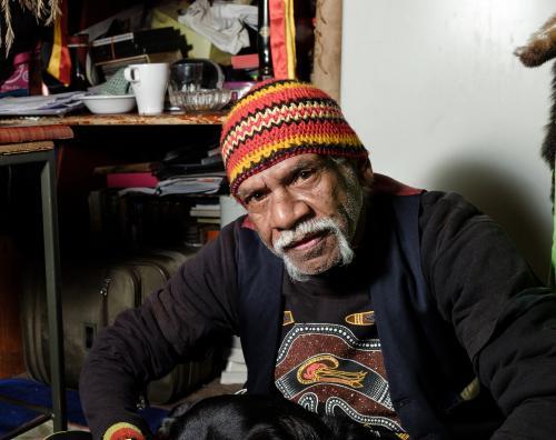 Indigenous Australian Man Looking at Camera - Australian Stock Image