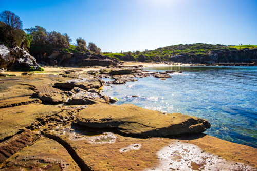 interesting rock formation at Little Bay beach - Australian Stock Image