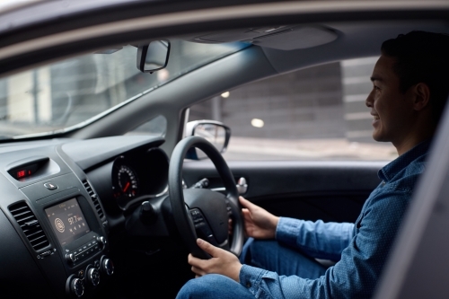 Interior of man driving car - Australian Stock Image