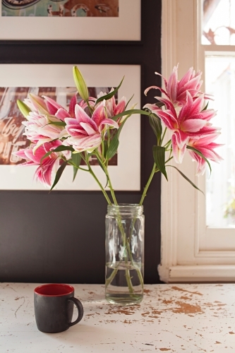 Interior vignette of flowers and coffee mug