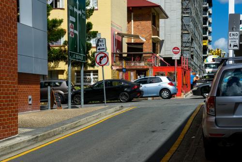 Intersection in the back streets of South Brisbane with traffic and construction work. - Australian Stock Image
