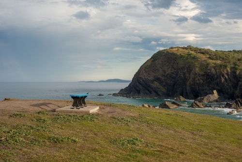 Island wth bench and blue waters - Australian Stock Image