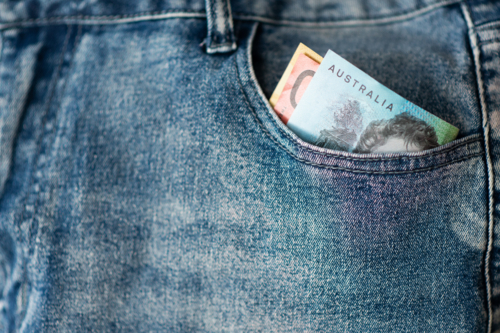 jeans with australian money in the pocket - Australian Stock Image