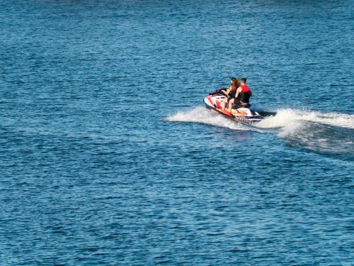 Jet ski speeding across water - Australian Stock Image