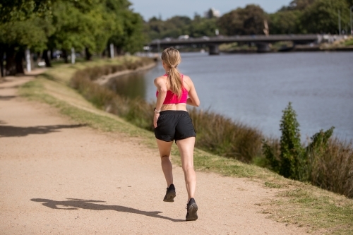 Jogging by the Yarra River - Australian Stock Image