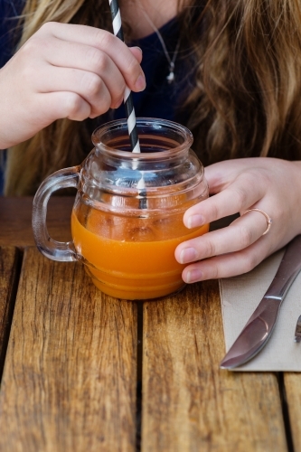 juice with straw - Australian Stock Image