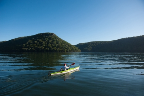 Kayaker paddling on the river - Australian Stock Image
