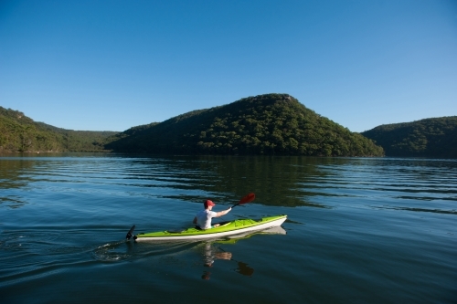 Kayaker paddling on the river - Australian Stock Image