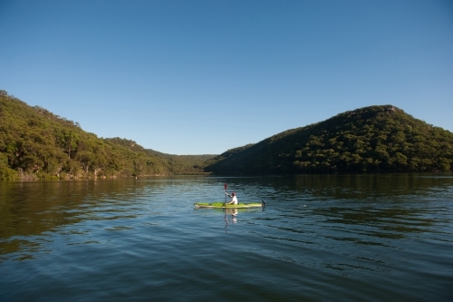 Kayaker paddling on the river - Australian Stock Image
