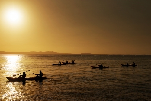 Kayakers at sunset paddling at 1770