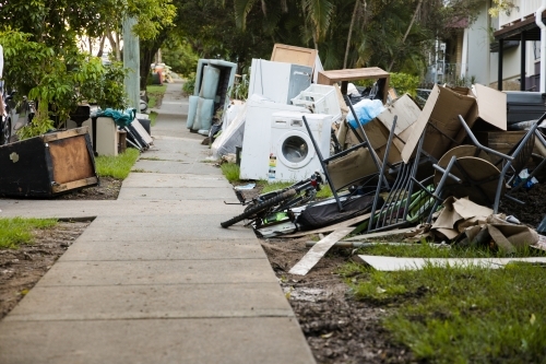Kerbside waste and rubbish put out for collection after major flooding - Australian Stock Image