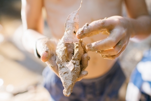 Kid's Mud Clay Creation - Australian Stock Image