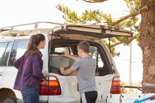 Kids getting stuff out of 4WD vehicle - Australian Stock Image