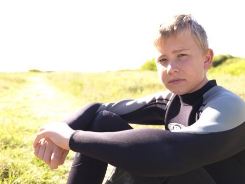 Kids preparing to do body boarding - Australian Stock Image