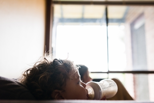 Kids watching movie at home - Australian Stock Image