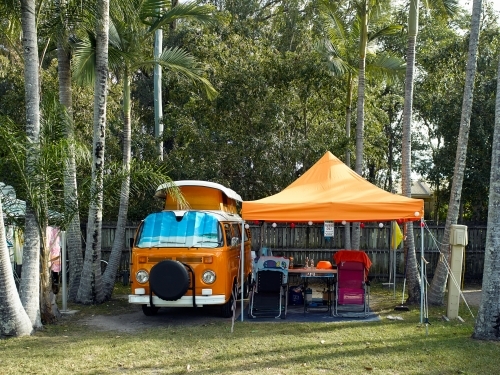 Kombi van and shelter in tropical campground - Australian Stock Image