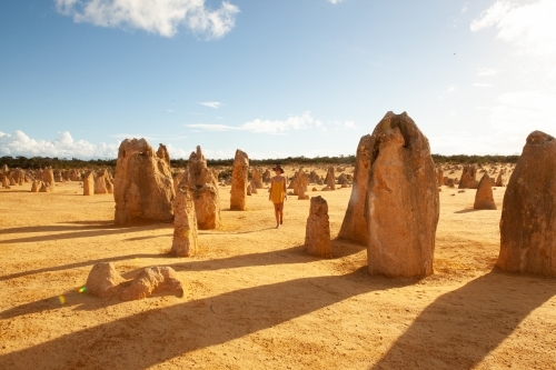 Lady in summery dress exploring the pinnacles, outback WA - Australian Stock Image
