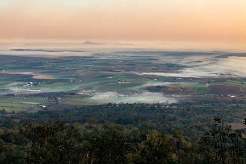Landscape with early morning  fog and low clouds in the Scenic Rim - Australian Stock Image