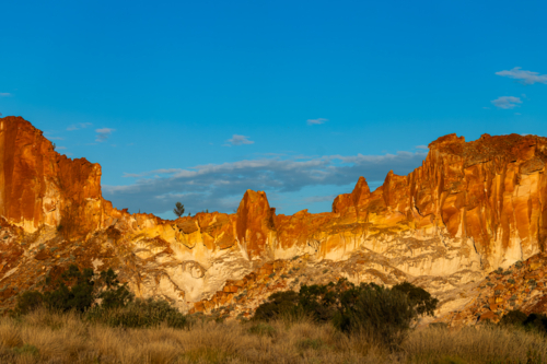 Landscape with Red rocky outcrop at Sunset - Australian Stock Image