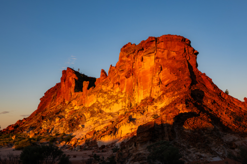 Landscape with Red rocky outcrop at Sunset - Australian Stock Image