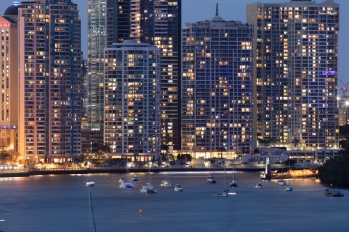 Large apartments buildings alongside the Brisbane River during the evening - Australian Stock Image