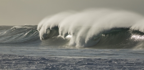 Large breaking wave with 'white horses' and blowback - Australian Stock Image