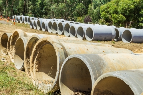 Large cement pipes laid out in rows - Australian Stock Image