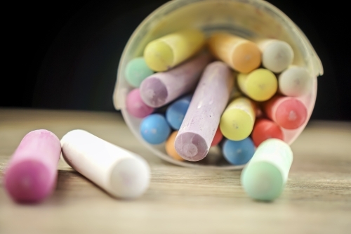 large chalk falling out of bucket - Australian Stock Image