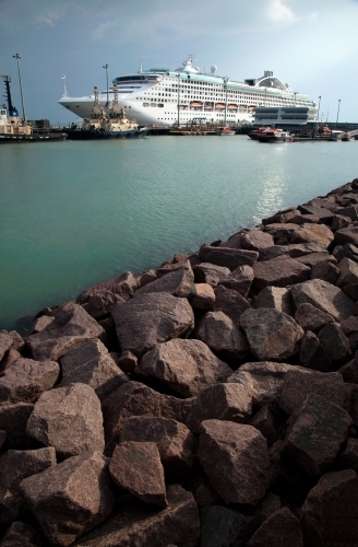 Large cruise liner docked at an industrial port - Australian Stock Image
