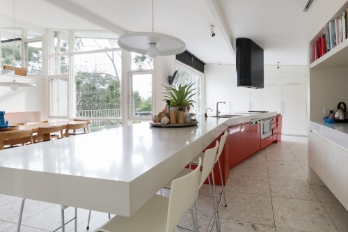 Large designer kitchen in modern home with  garden outlook
