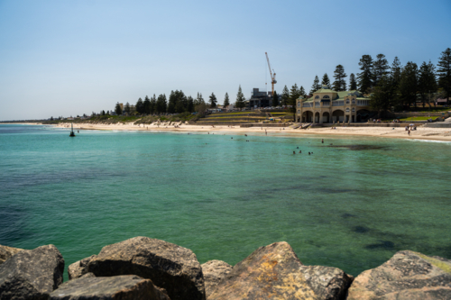 Large granite boulders on the foreground with Indiana Tea House on the shore - Australian Stock Image